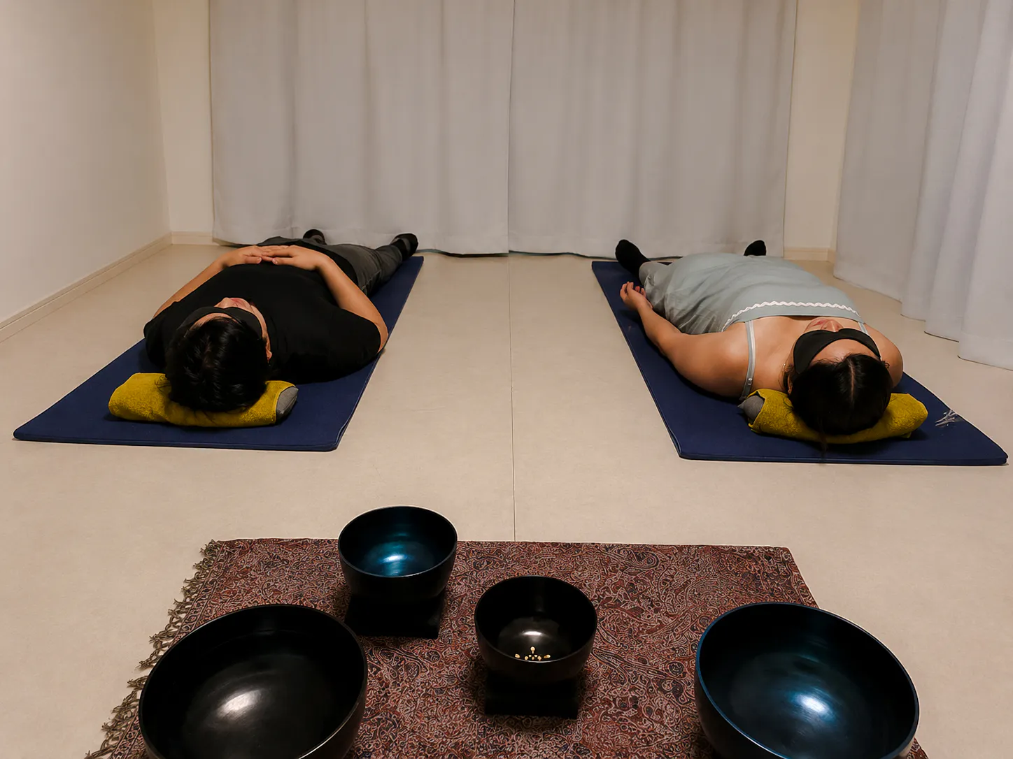 Participants in lying-down meditation with sound bowls, Kyoto.