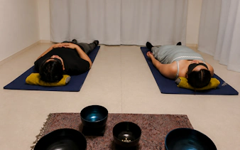 Participants in lying-down meditation with sound bowls, Kyoto.