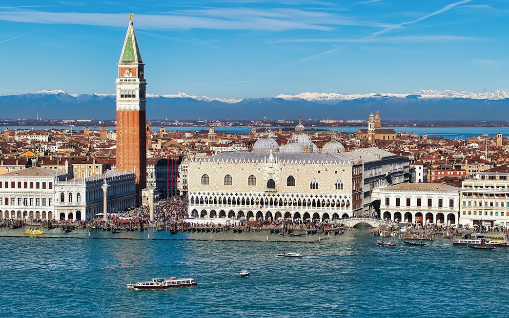 Doge's Palace aerial view with boats on the Grand Canal, Venice, Italy.