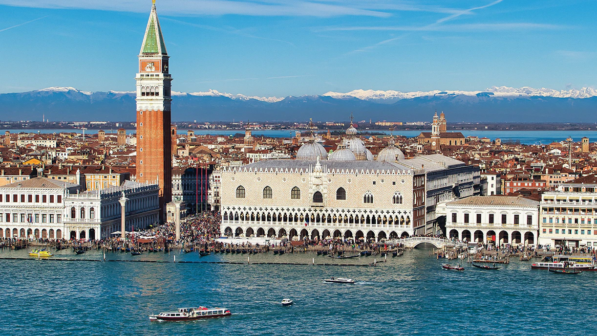 Doge's Palace aerial view with boats on the Grand Canal, Venice, Italy.