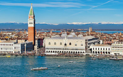 Doge's Palace aerial view with boats on the Grand Canal, Venice, Italy.
