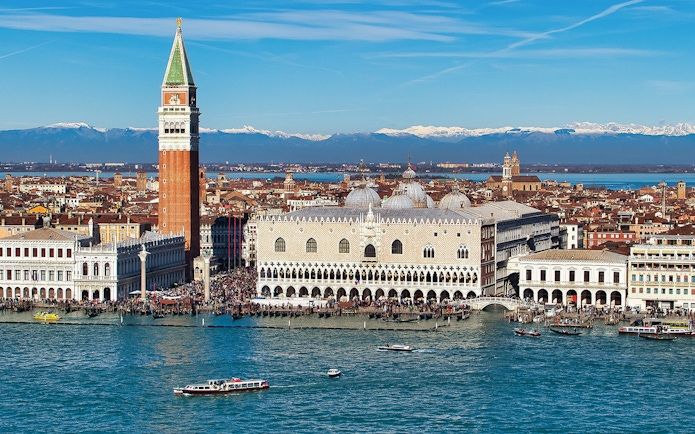 Doge's Palace aerial view with boats on the Grand Canal, Venice, Italy.