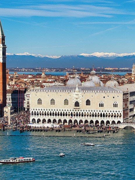 Doge's Palace aerial view with boats on the Grand Canal, Venice, Italy.