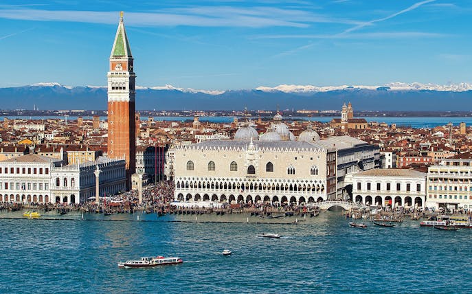 Doge's Palace aerial view with boats on the Grand Canal, Venice, Italy.