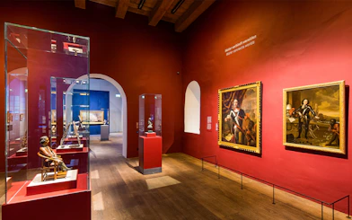 Exhibit of maritime artifacts and paintings inside The Maritime Museum, Amsterdam.