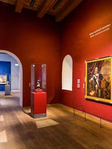 Exhibit of maritime artifacts and paintings inside The Maritime Museum, Amsterdam.