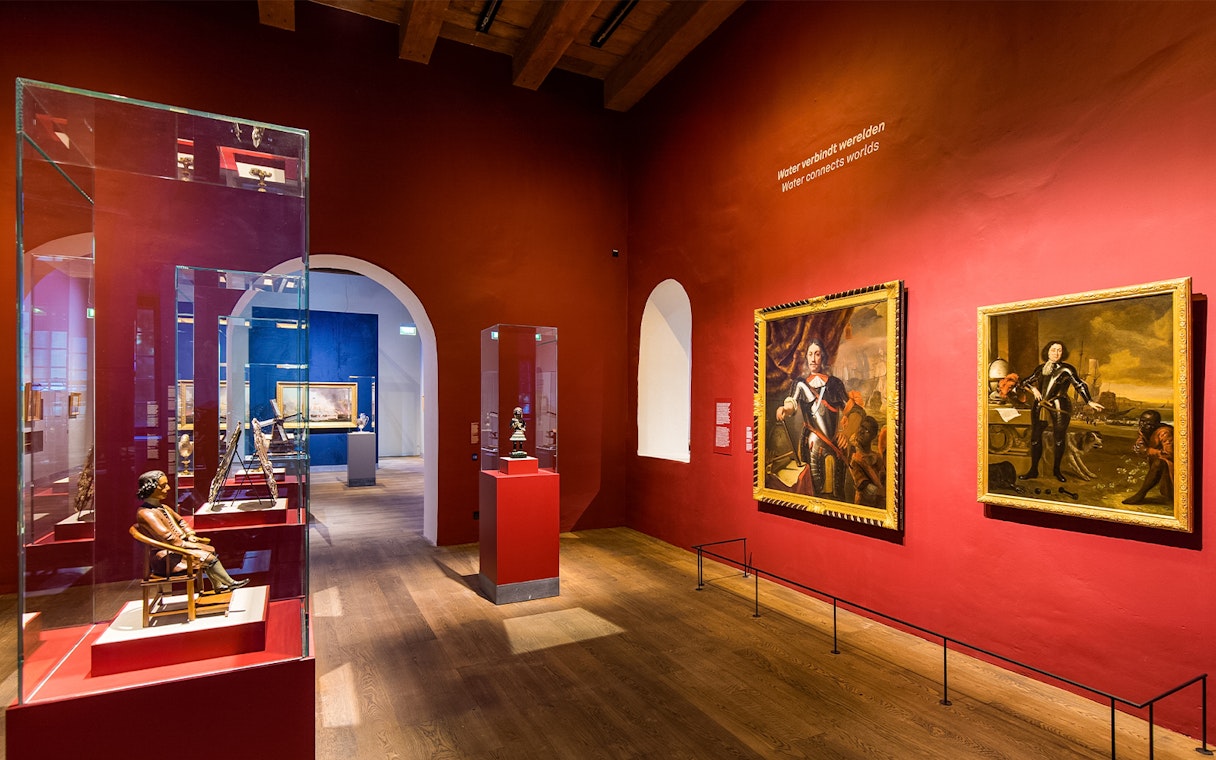 Exhibit of maritime artifacts and paintings inside The Maritime Museum, Amsterdam.