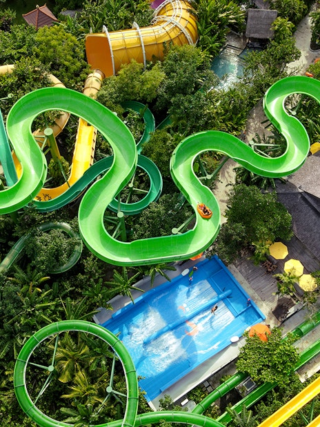 Aerial view of winding waterslides and wave pool at Waterbom Bali.