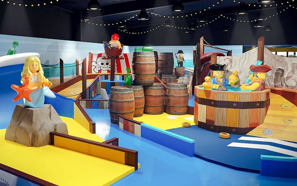 Pirate-themed mini golf course at LEGOLAND® Adventure Golf with ship and treasure elements, Billund, Denmark.