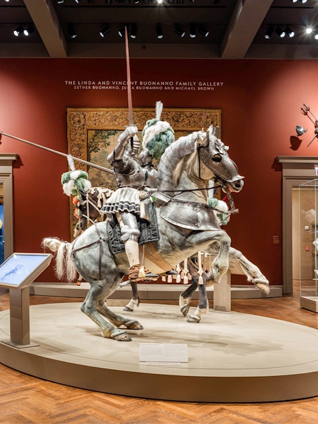 Mounted knight armor display at The Art Institute of Chicago's arms and weaponry gallery.