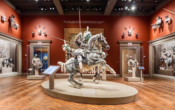 Mounted knight armor display at The Art Institute of Chicago's arms and weaponry gallery.