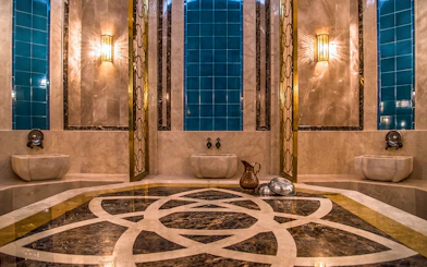 Private historical hammam bath interior with marble and blue tiles in Cappadocia, Turkey.