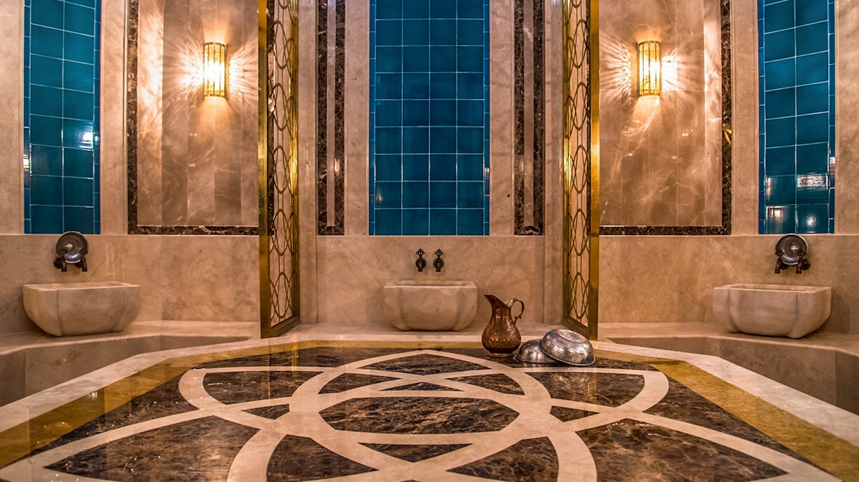 Private historical hammam bath interior with marble and blue tiles in Cappadocia, Turkey.