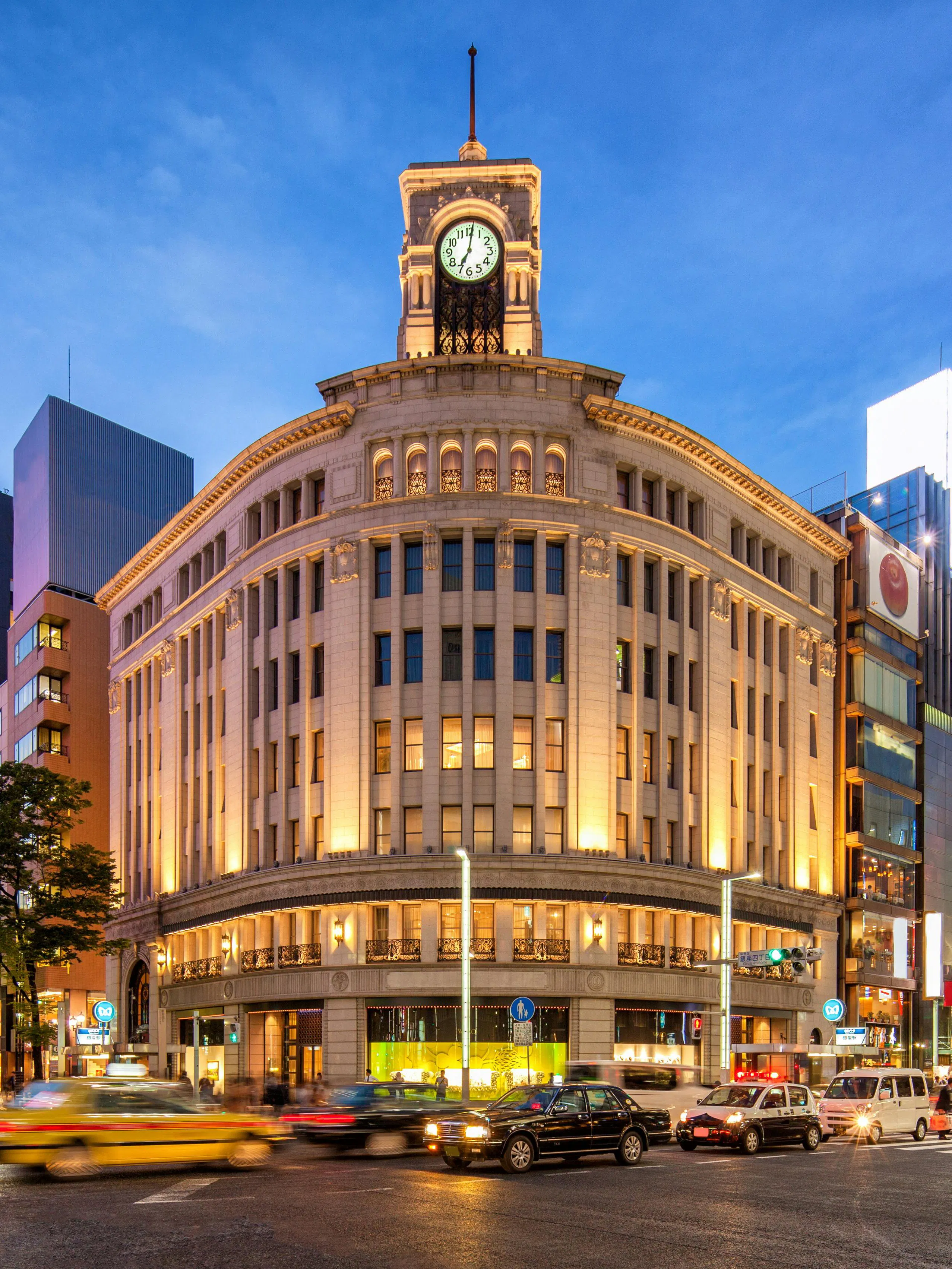 Wako Department Store with clock tower in Ginza, Tokyo, at dusk.