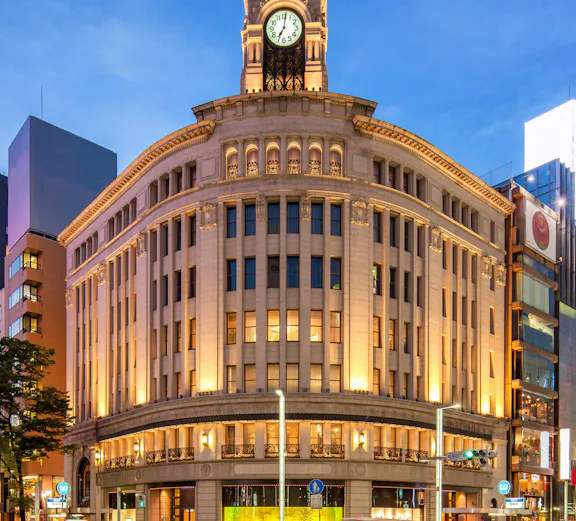Wako Department Store with clock tower in Ginza, Tokyo, at dusk.