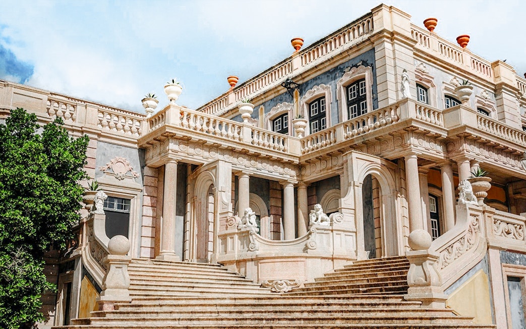 Robillion Pavilion at National Palace of Queluz with ornate staircase and sculptures.