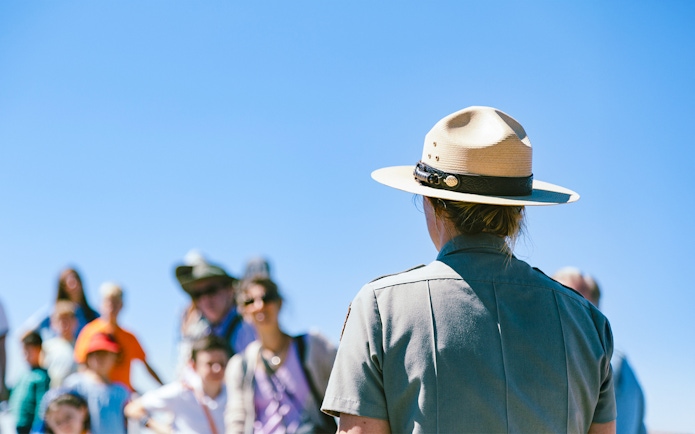 Park ranger guiding tourists at Alcatraz Island, San Francisco.