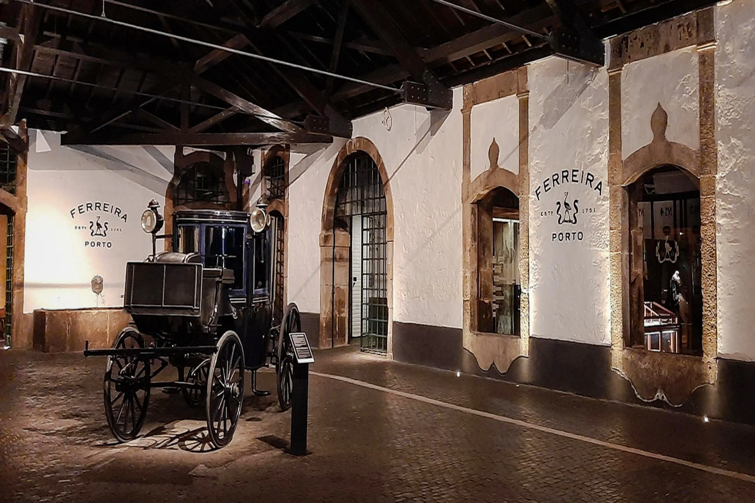 Ferreira Port Wine Cellar interior with vintage carriage, Porto.