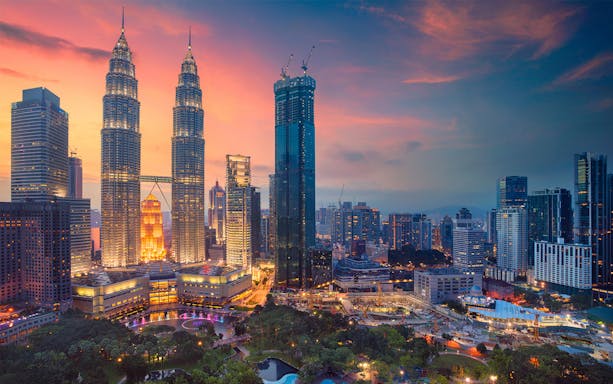 Kuala Lumpur skyline with Petronas Towers at sunset, Malaysia.
