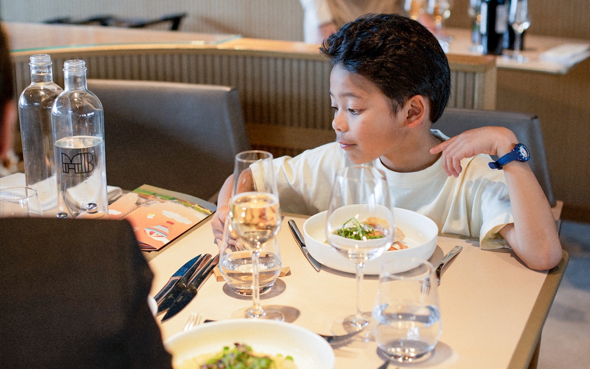 Lunch setting at Madame Brasserie, Eiffel Tower, with a child dining.