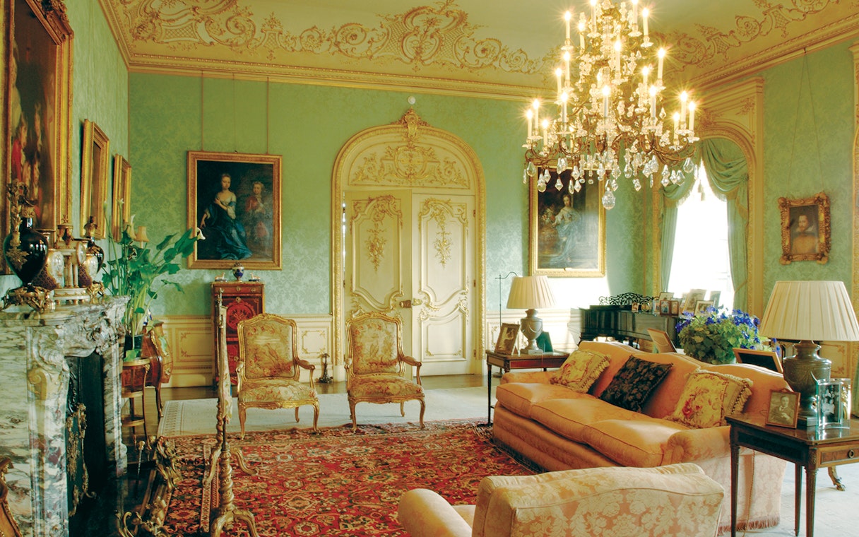 Highclere Castle drawing room with ornate decor and chandelier on Downton Abbey tour.