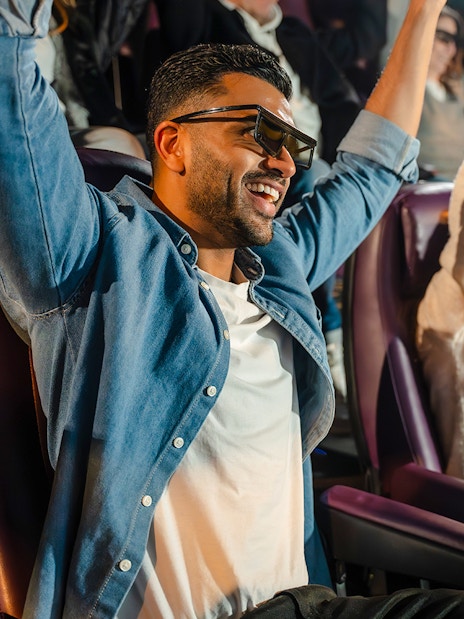 Visitors enjoying 4D Chocolate Adventure at Cadbury World with 3D glasses.