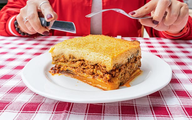 Vegan moussaka served on a white plate during Athens Original Vegan Tour.