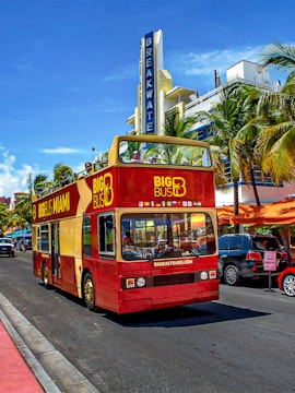 Big Bus Miami tour passing Breakwater Hotel on Ocean Drive.