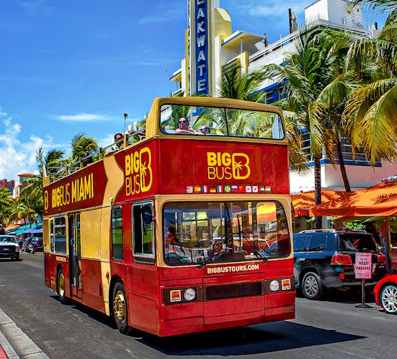 Big Bus Miami tour passing Breakwater Hotel on Ocean Drive.