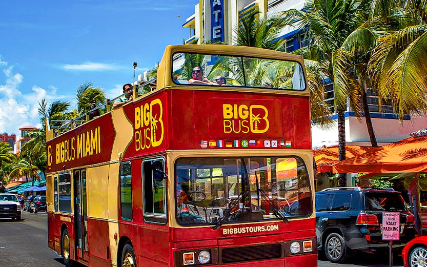 Big Bus Miami tour passing Breakwater Hotel on Ocean Drive.