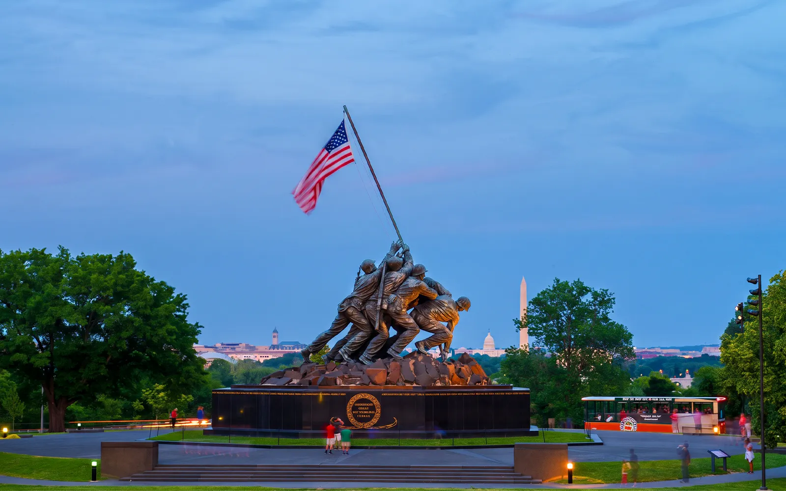 Iwo Jima Memorial with Washington Monument in the background during a moonlight bus tour in Washington DC.