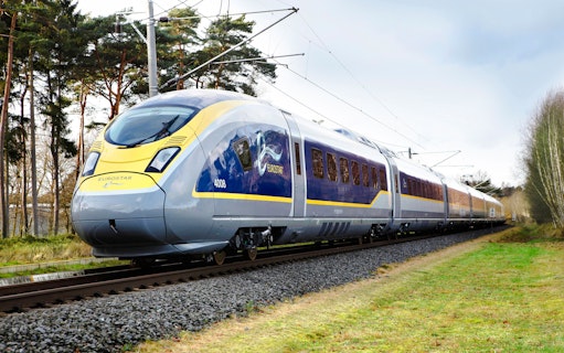 Eurostar train traveling from Paris Nord to London St Pancras International through countryside.