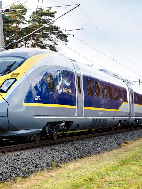 Eurostar train traveling from Paris Nord to London St Pancras International through countryside.
