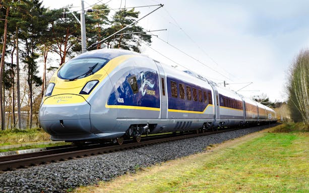 Eurostar train traveling from Paris Nord to London St Pancras International through countryside.