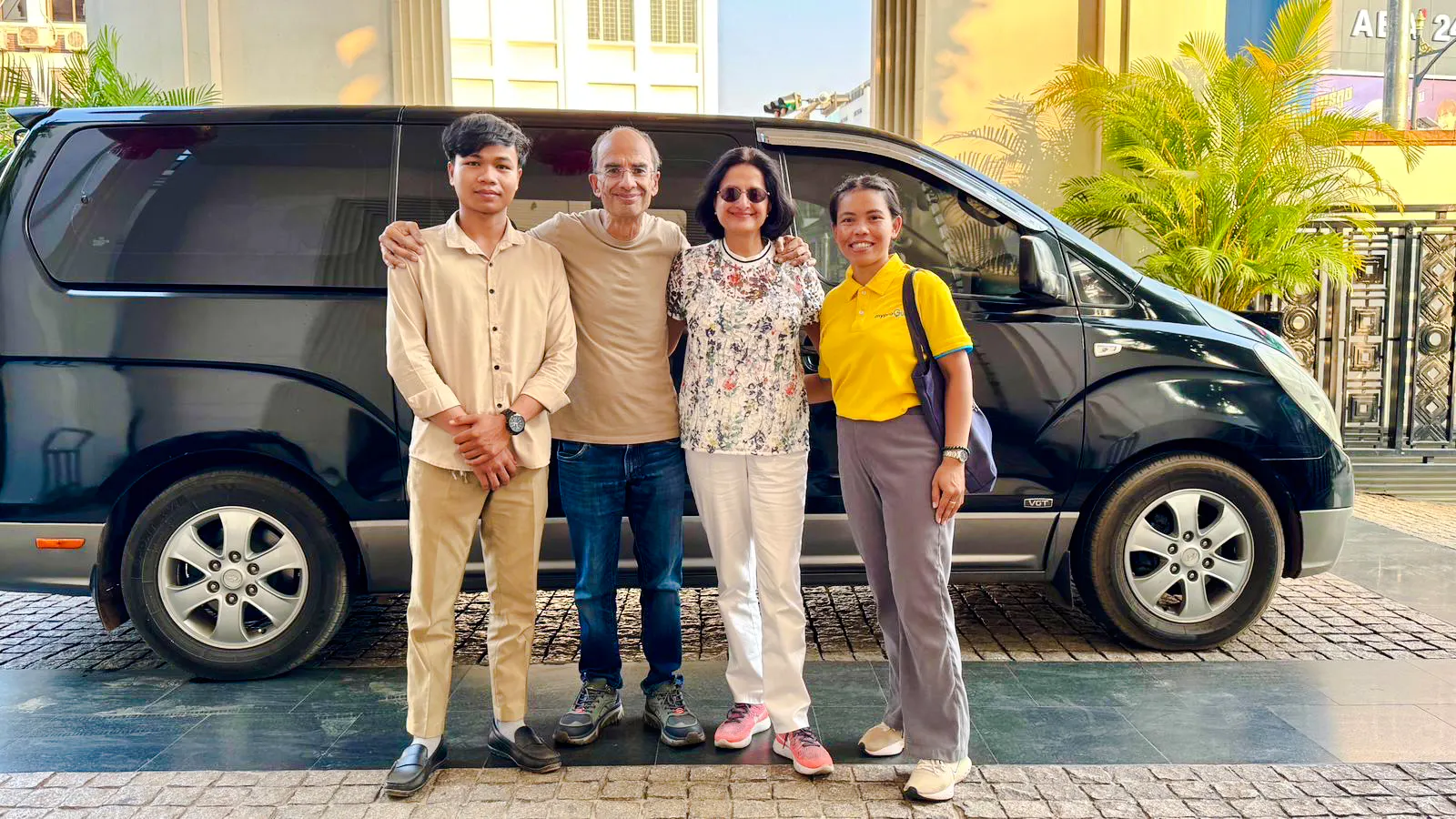 Group standing in front of a van for Siem Reap Angkor Airport private transfer.