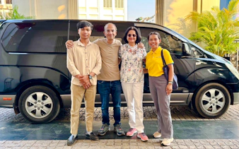 Group standing in front of a van for Siem Reap Angkor Airport private transfer.