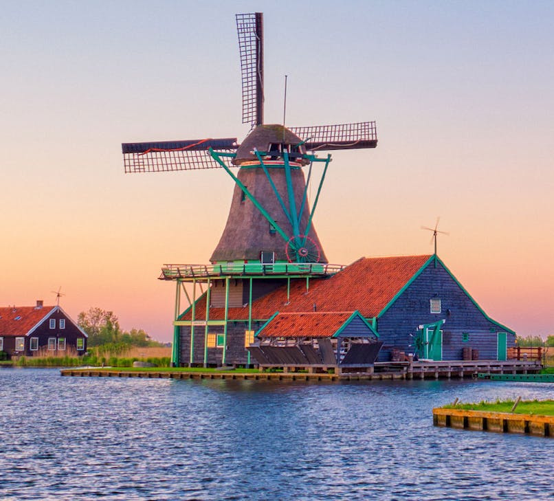 Zaanse Schans windmills in Amsterdam with traditional Dutch architecture.
