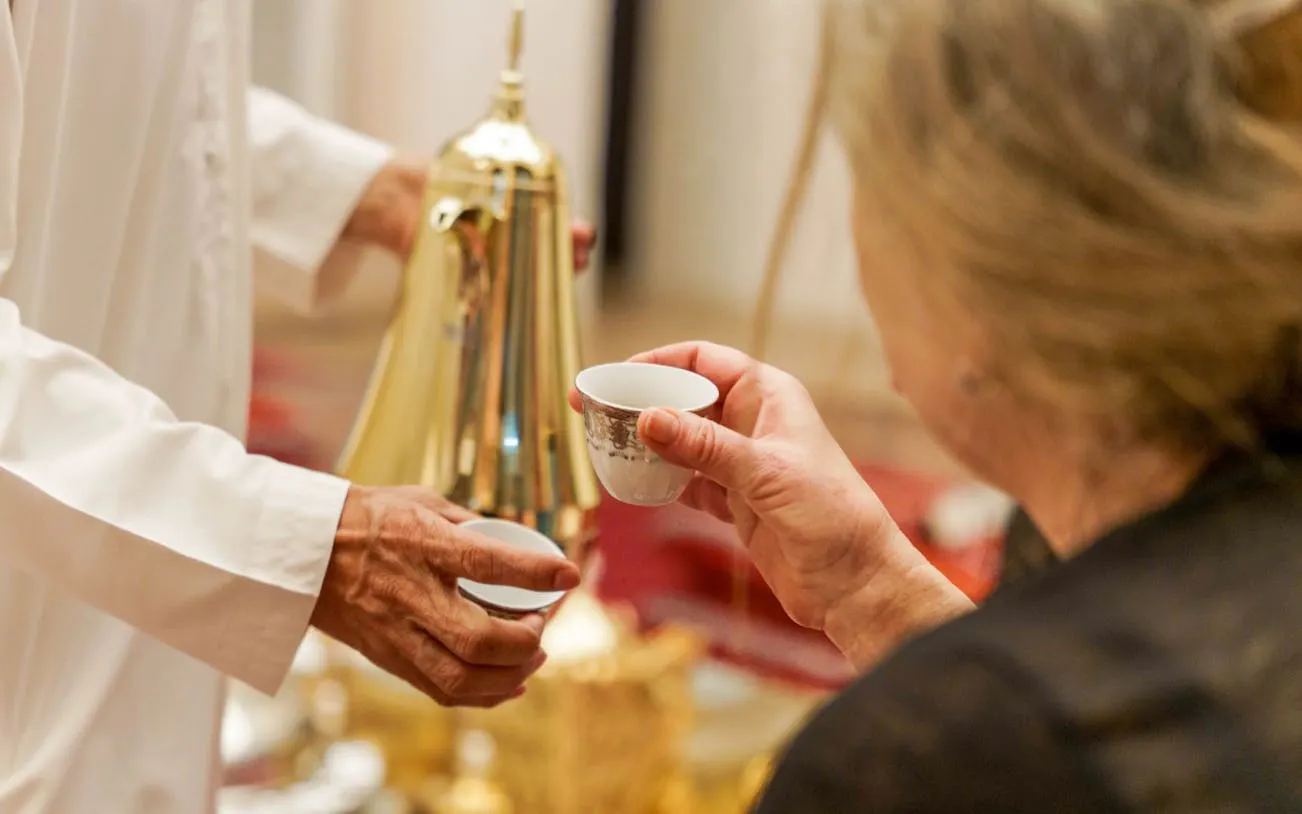Serving traditional Arabic coffee during Emirati Trolley Tour in Dubai.