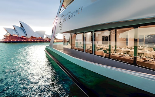 Cruise ship near Sydney Opera House during Sydney Harbour fine dining cruise.