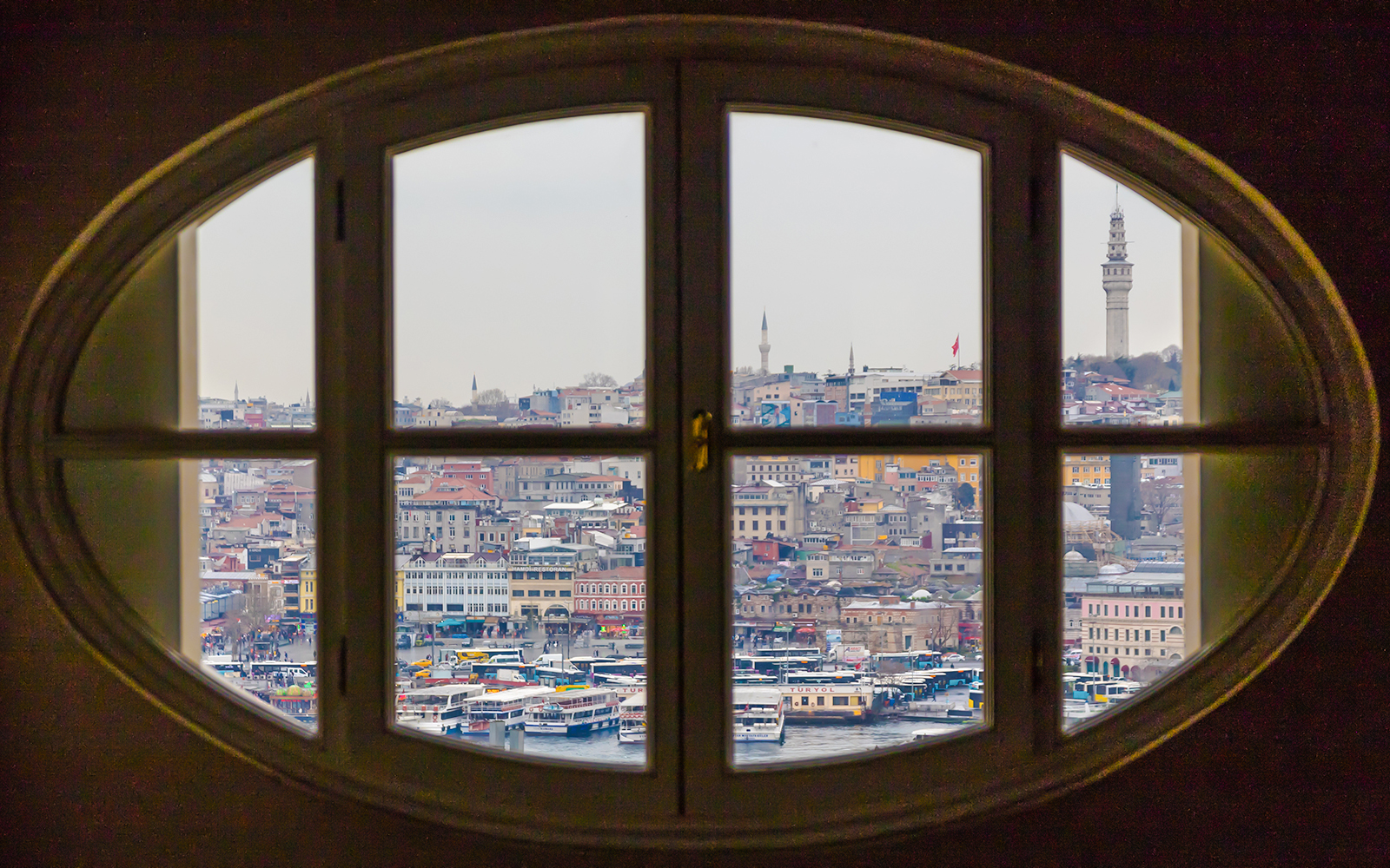View of Istanbul cityscape through an oval window at the Salt Museum.