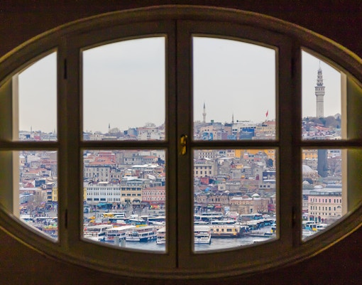 View of Istanbul cityscape through an oval window at the Salt Museum.
