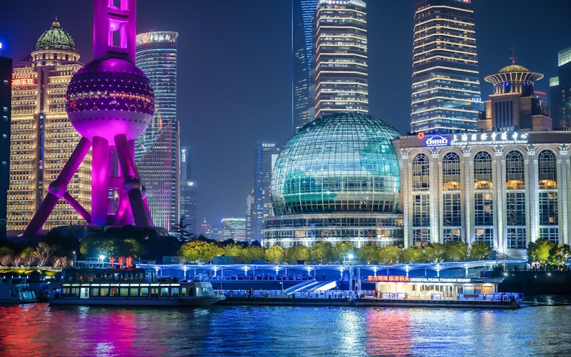Night view of Oriental Pearl Tower and cruise on Huangpu River, Shanghai.