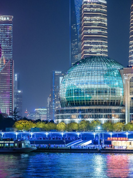 Night view of Oriental Pearl Tower and cruise on Huangpu River, Shanghai.