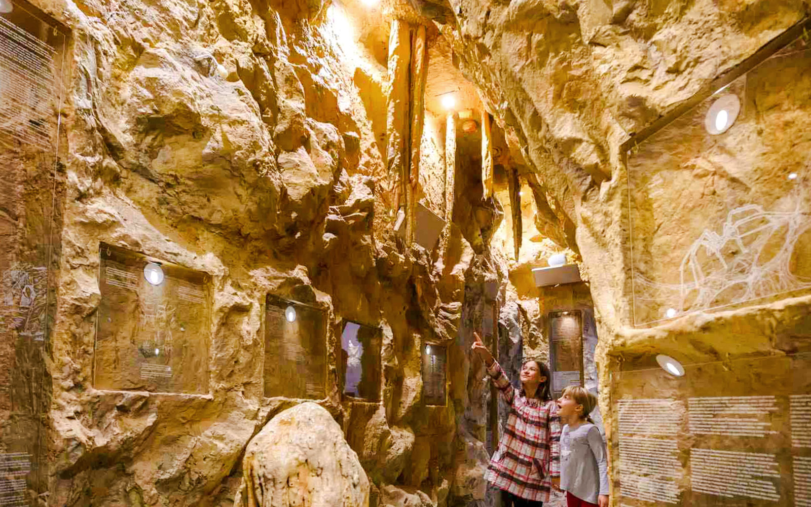 Visitors exploring a cave exhibit on the Split Panoramic Bus Tour.