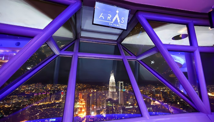 View of Kuala Lumpur cityscape from ARAS restaurant in KL Tower at night.