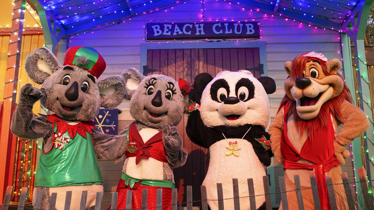 Costumed characters at San Diego Zoo's Beach Club, featuring koalas and a panda.