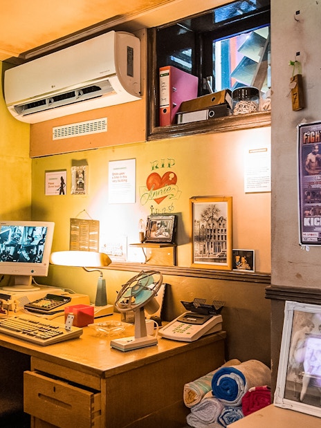Office setup with vintage computer and decor at Red Light Secrets Museum of Prostitution.