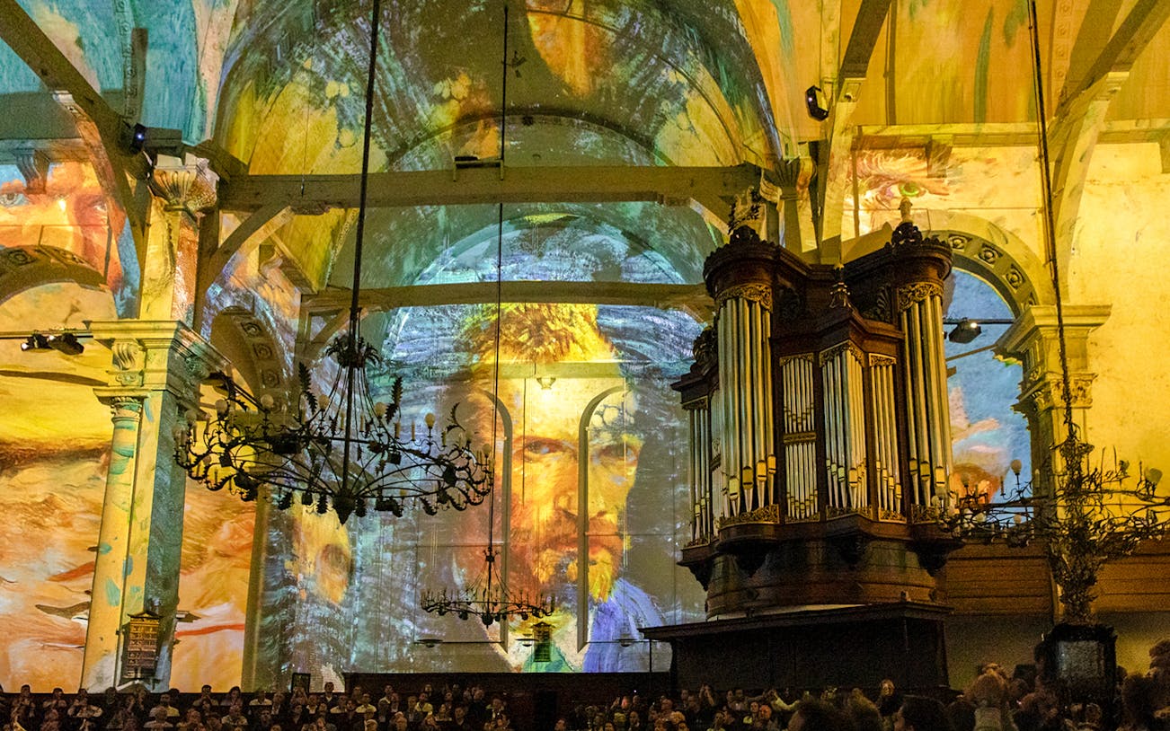 Van Gogh and Rembrandt projections on church walls during sound and light show.