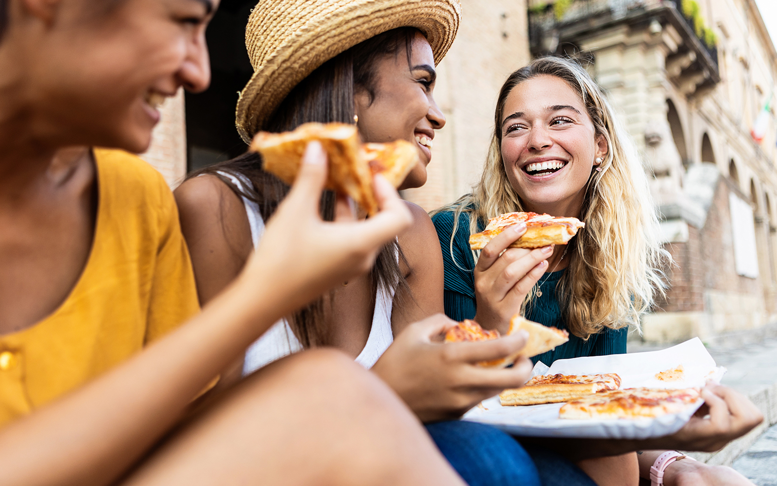Women enjoying street food at Tivoli Town, Italy.
