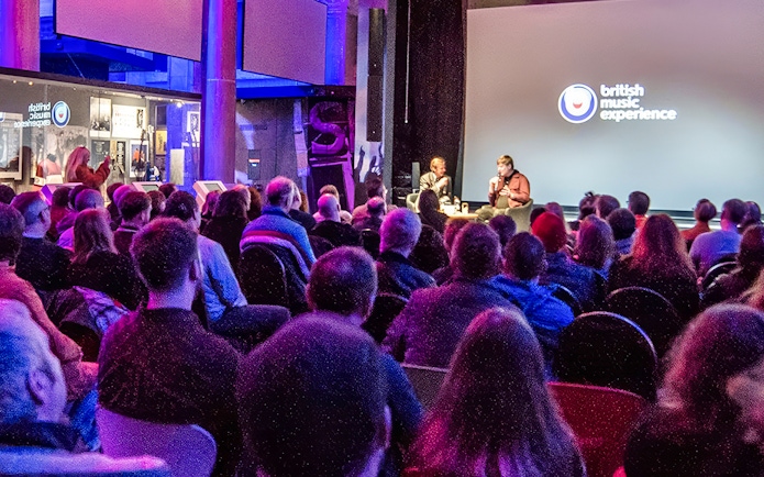 Audience attending a talk at the British Music Experience in Liverpool.